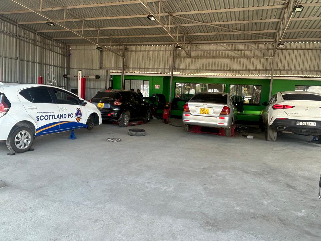 Vehicles being serviced inside the Proxima Tyres workshop